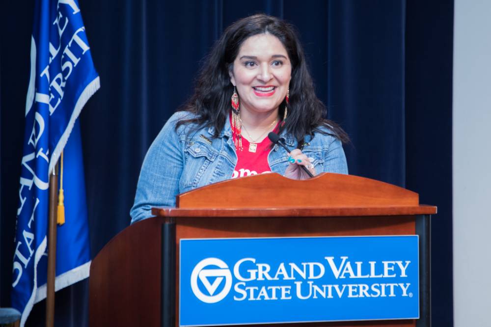 Woman standing at  Grand Valley State University podium